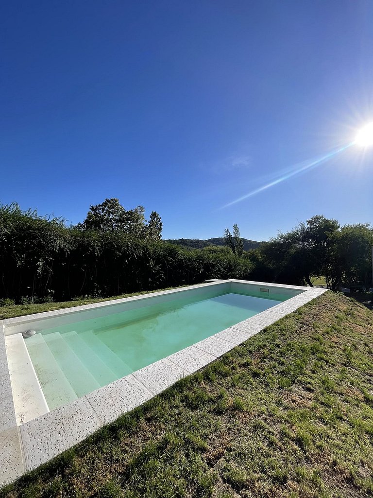 Casa com piscina em condomínio de golfe